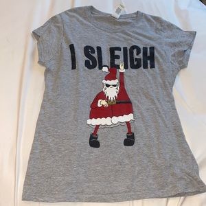 A gray Christmas shirt with Santa and a saying on the front.